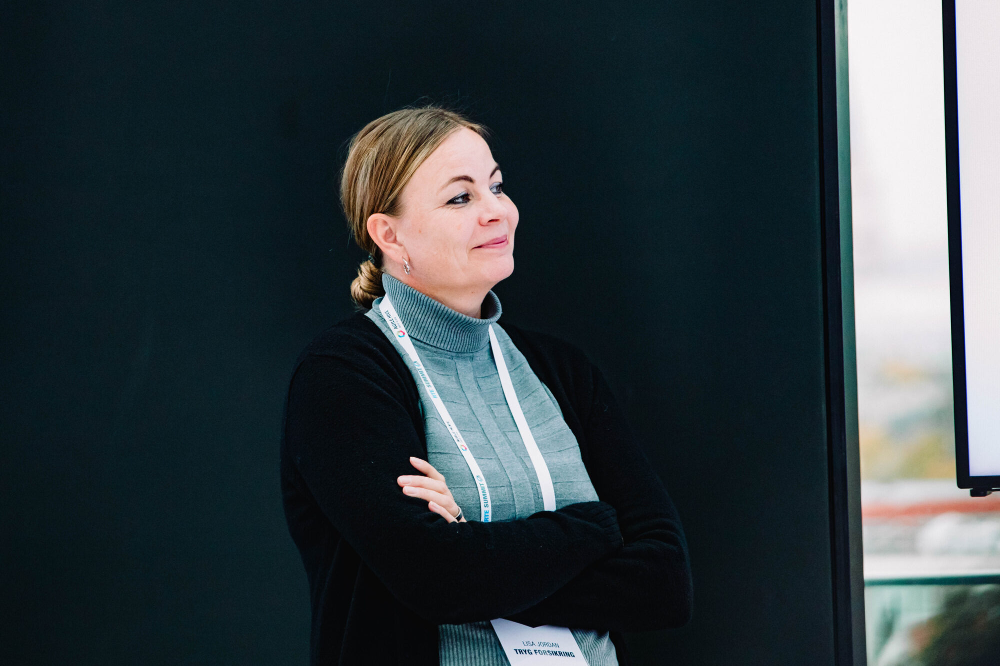 Event photography brief: an event organiser following a presentation during a corporate event