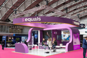 Purple custom-designed exhibition stand photographed at a major trade show in Madrid.