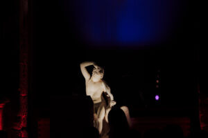 Dramatic lighting on a classical sculpture during an evening gala at Museo del Prado, Madrid
