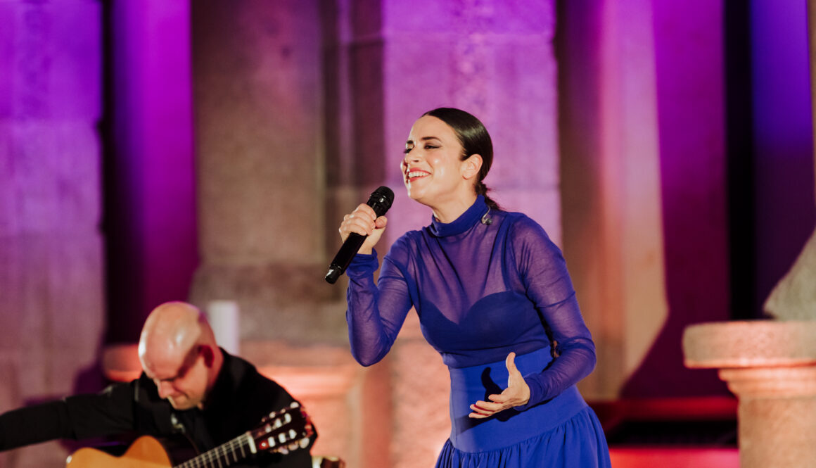Flamenco singer performing with guitarist during a luxury gala at Museo del Prado, Madrid
