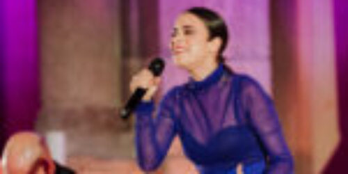 Flamenco singer performing with guitarist during a luxury gala at Museo del Prado, Madrid