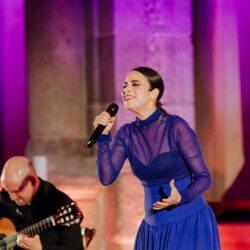 A flamenco singer performing with a guitarist during a luxury gala at the Museo del Prado, Madrid