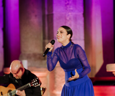 Flamenco singer performing with guitarist during a luxury gala at Museo del Prado, Madrid