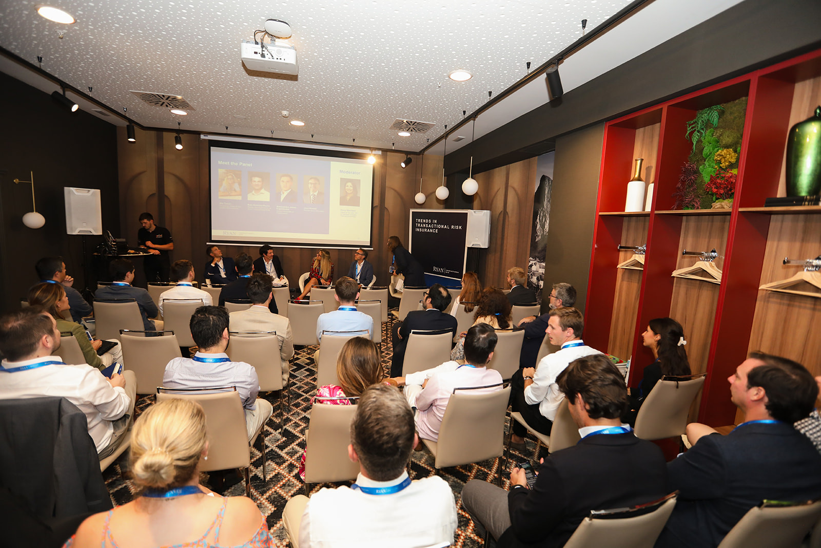 Attendees following a presentation in a corporate meeting room in Madrid