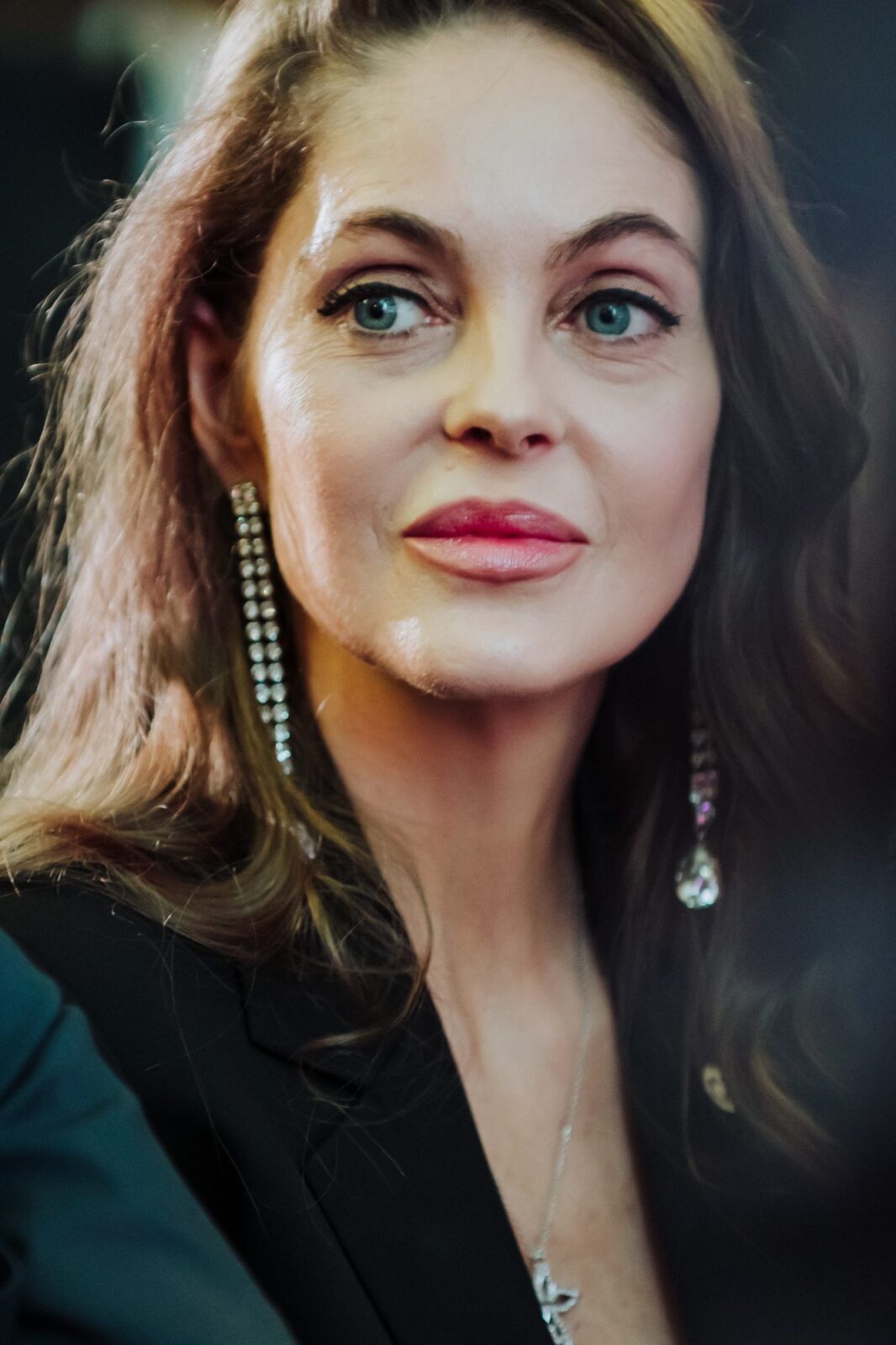 Event Photographer in Madrid: Our Coverage of the CONAF Women in Economy Gala at the Real Casino de Madrid - nicoletalupuagency Candid portrait of a guest during the speeches at the Gala Women in Economy, Real Casino de Madrid