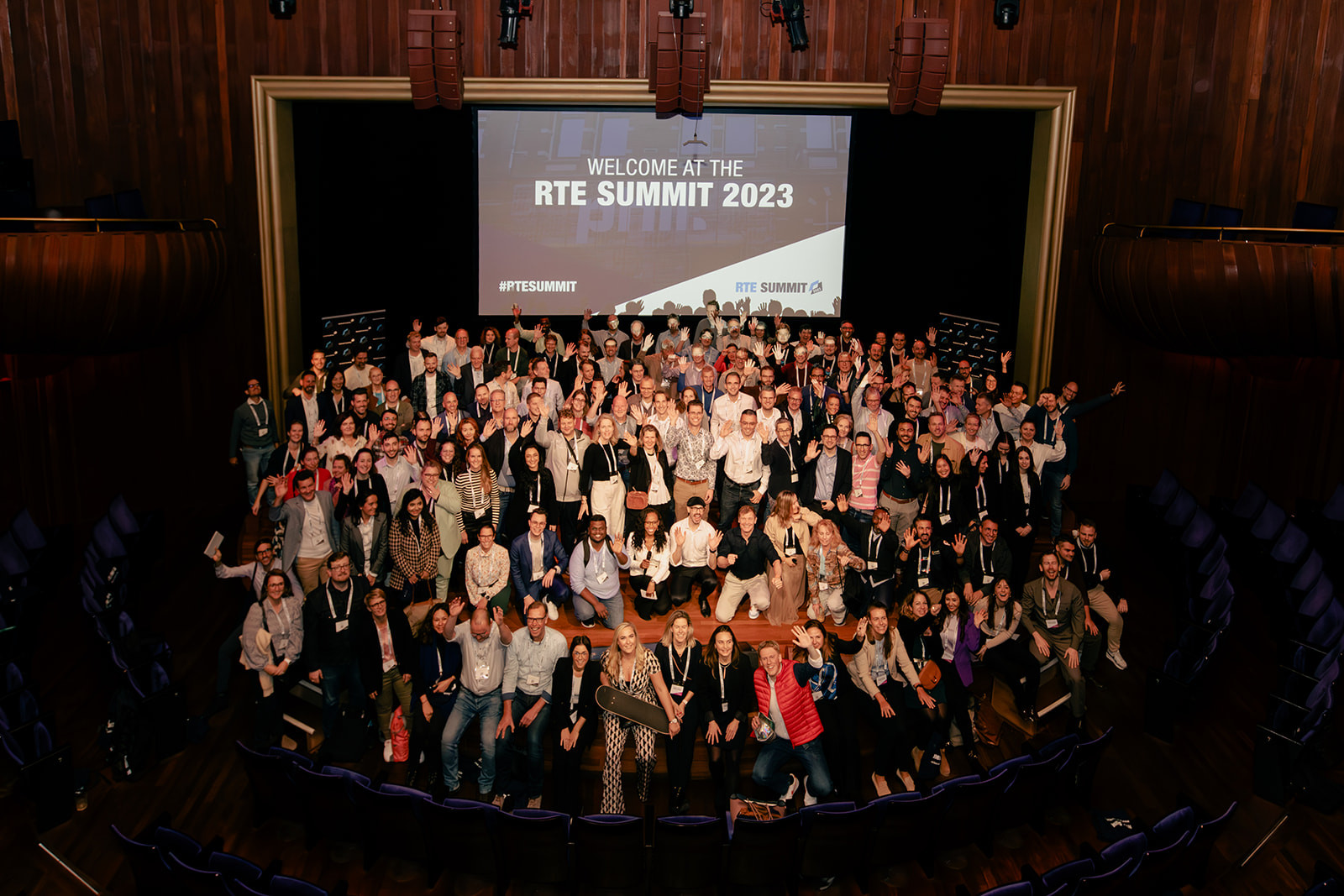 Official group photo of several hundred attendees at a summit in Madrid